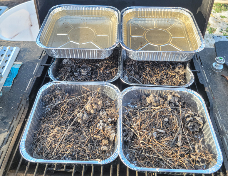 Pre-fire preparation with dry plant debris on the bottom shelf Pre-fire preparation with dry plant debris on the bottom shelf