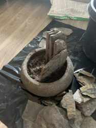 The process of building a crevice garden in a container. The process of building a crevice garden in a container.