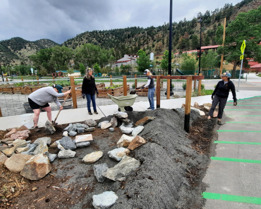 Volunteers work placing the rocks Volunteers work placing the rocks
