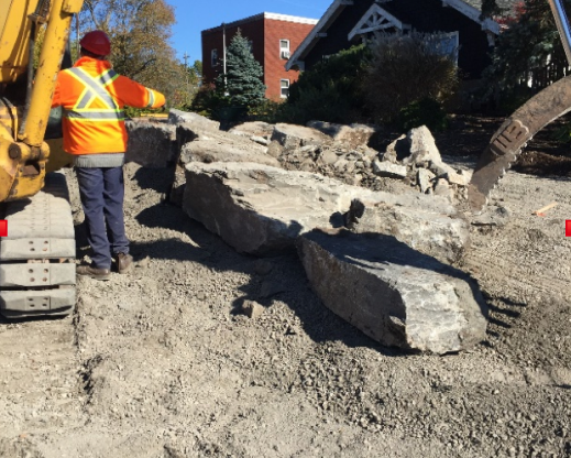 Dr. Bernard Jackson directing the placement of rocks in the garden.