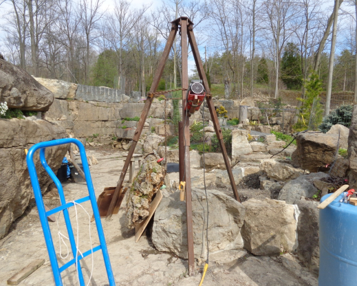 Lifting a tufa slab into place with a tripod and electric winch. Lifting a tufa slab into place with a tripod and electric winch.