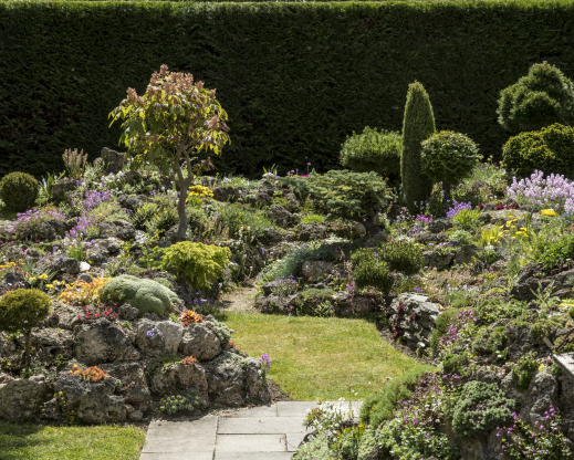 The garden is made of rocky outcrops rising up out of the lawn.