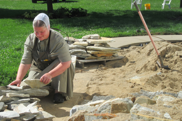 Esther building a new crevice  bed in her garden